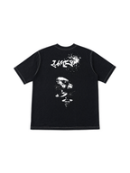 T-shirt Essence Tee LUMIS noir posé à plat, vue de dos : tag LUMIS et visage sérigraphiés en blanc